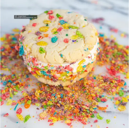 A Spilled Milk Fruity Pebble topped Ice cream sandwich