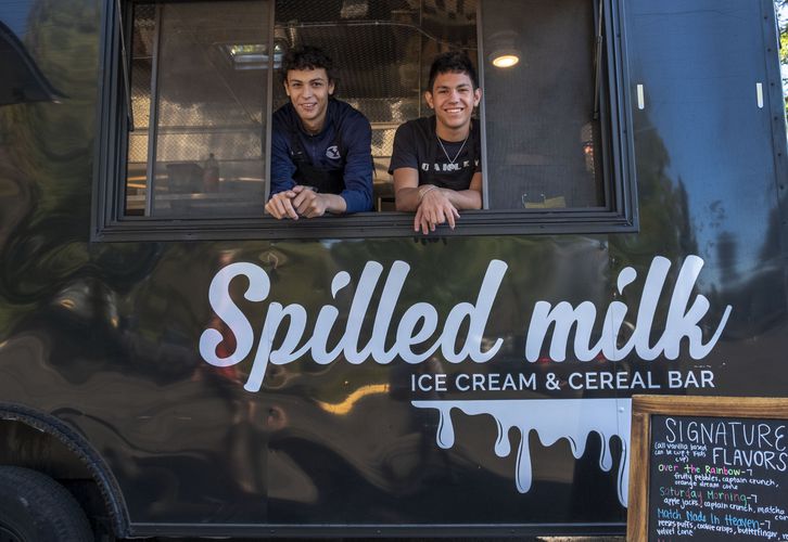 Two employees working out of the Spilled Milk Ice Cream truck