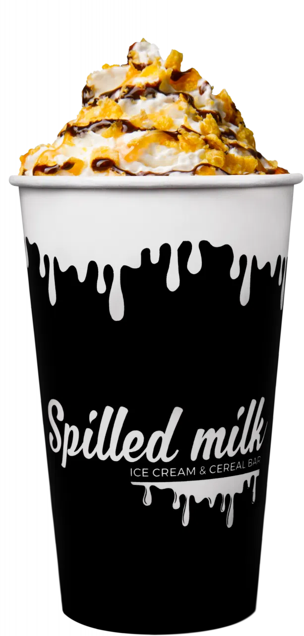 A spilled milk cup with whipped cream and frosted flakes